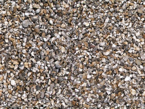 Image brown and white pebbles on ground