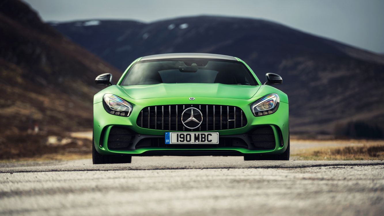 green mercedes benz car on road during daytime