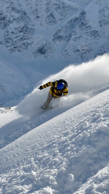 Image yellow and black snow ski on snow covered mountain during daytime