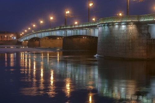 Image gray concrete bridge over water during night time