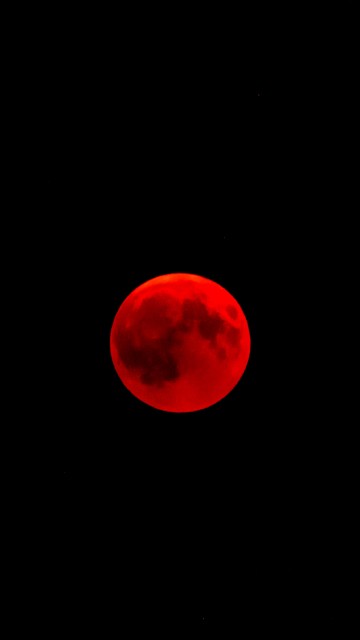 Image red moon in black background