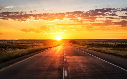 Image gray concrete road during sunset