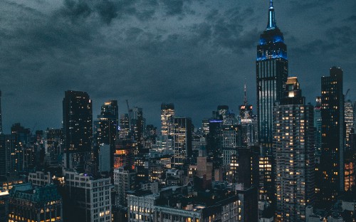 Image high rise buildings under gray clouds