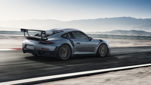 Image gray porsche 911 on gray asphalt road during daytime