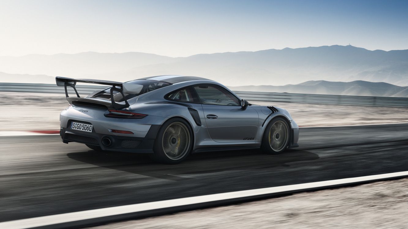 gray porsche 911 on gray asphalt road during daytime