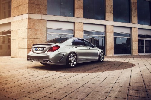 Image silver mercedes benz coupe parked beside brown brick building