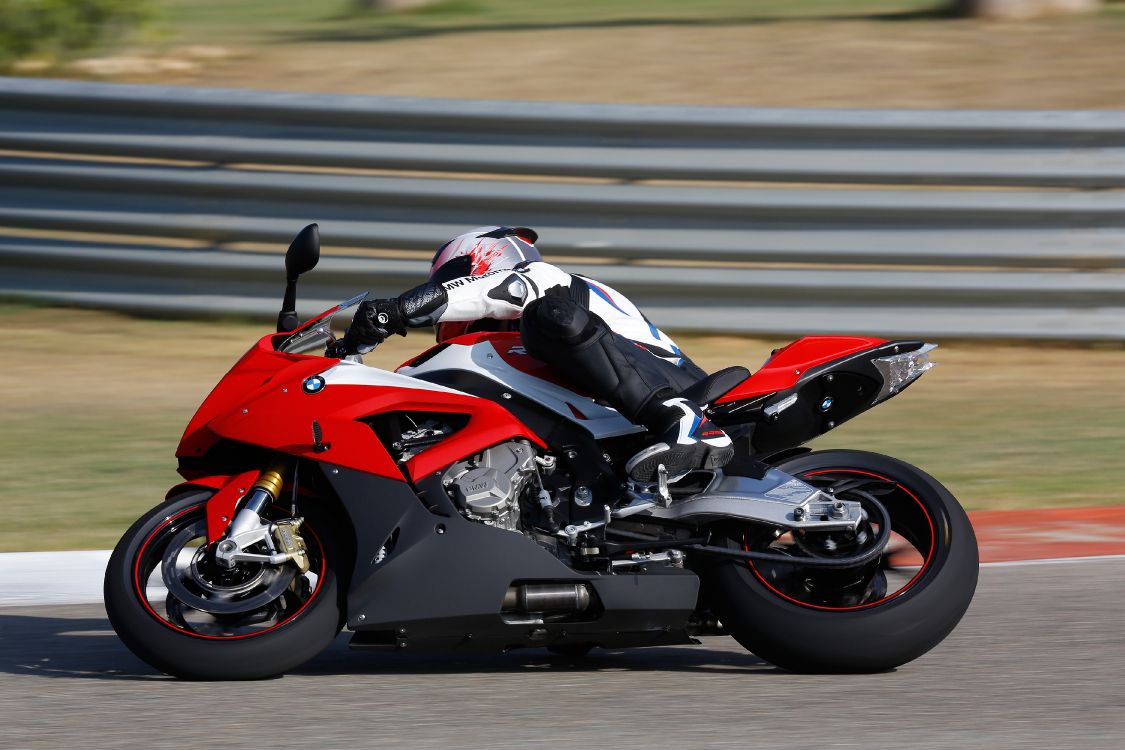 Man in Black and Red Sports Bike Helmet Riding on Red and Black Sports Bike. Wallpaper in 3750x2500 Resolution
