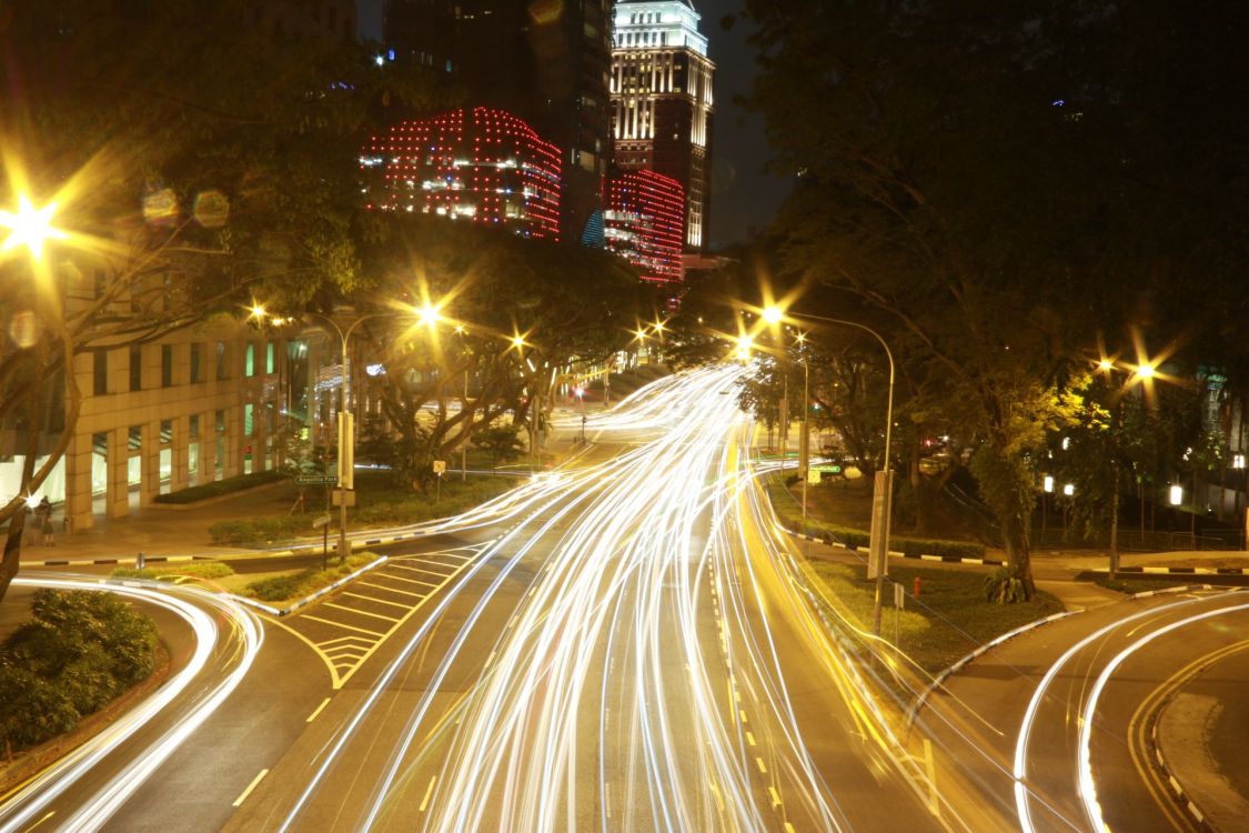 time lapse photography of cars on road during night time