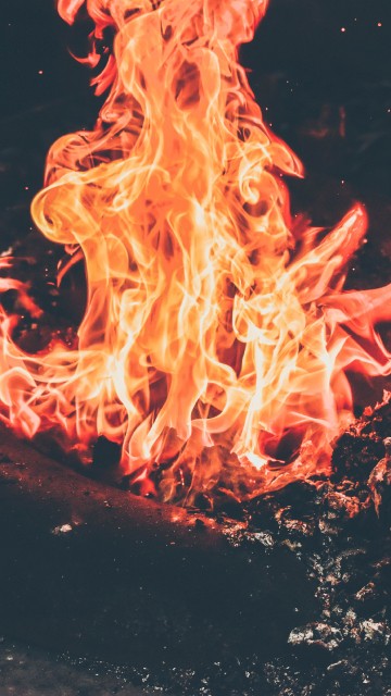 Image orange fire in black background