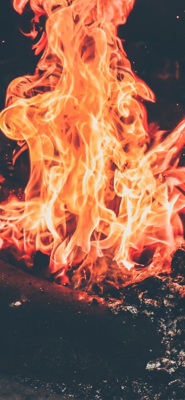 Image orange fire in black background