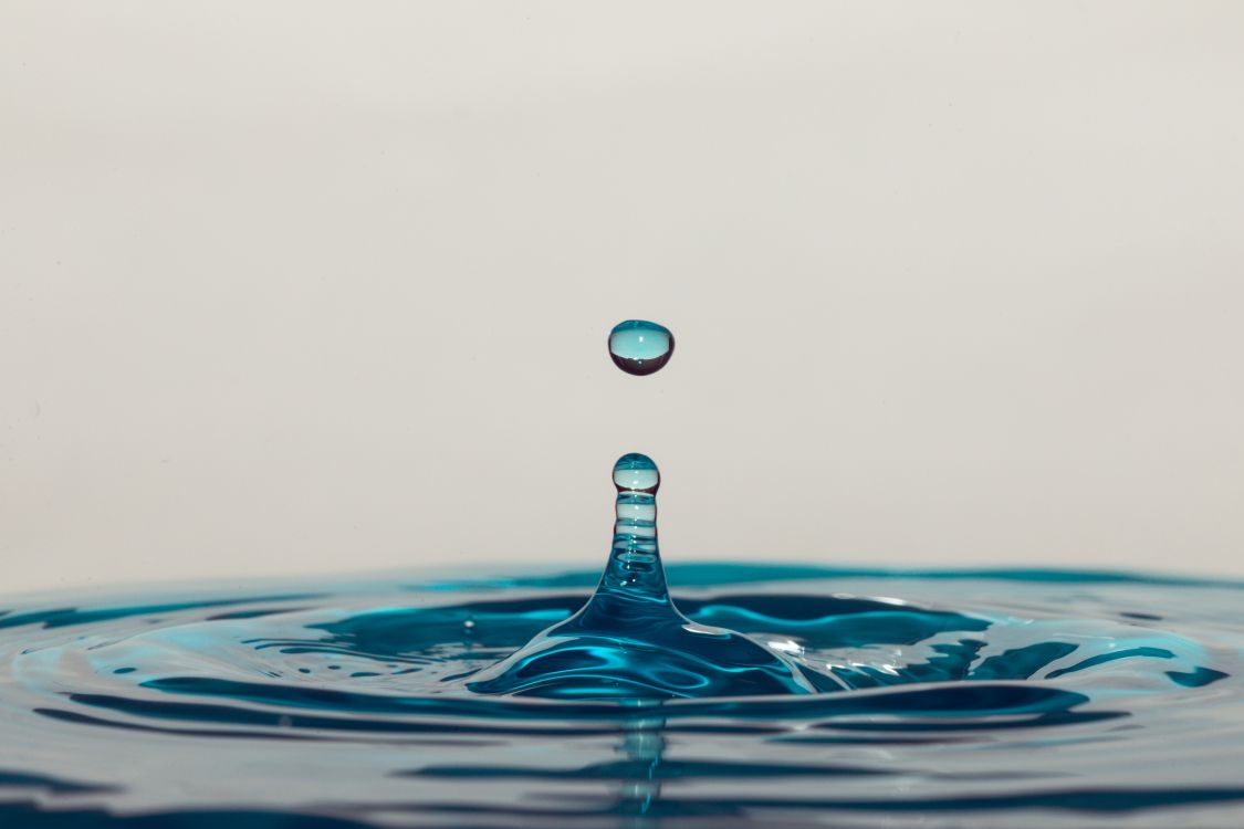 water drop on blue water