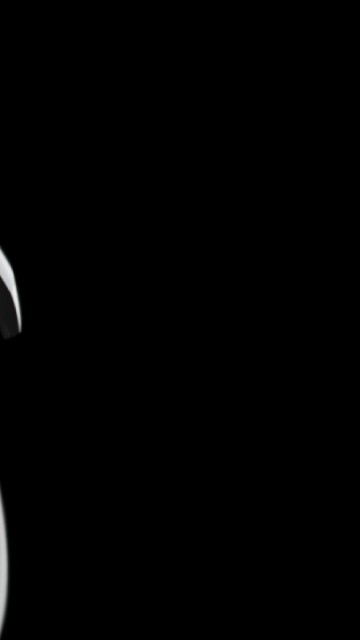 Image white and black headphones on white surface