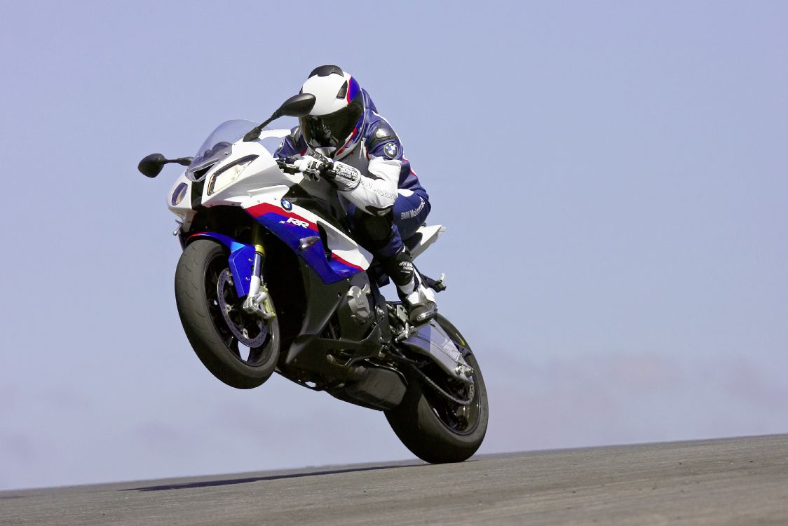 Man in White and Black Motorcycle Helmet Riding White and Black Sports Bike. Wallpaper in 3750x2501 Resolution