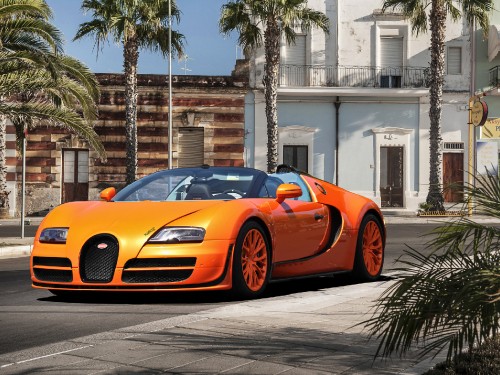 Image orange lamborghini aventador parked on street during daytime