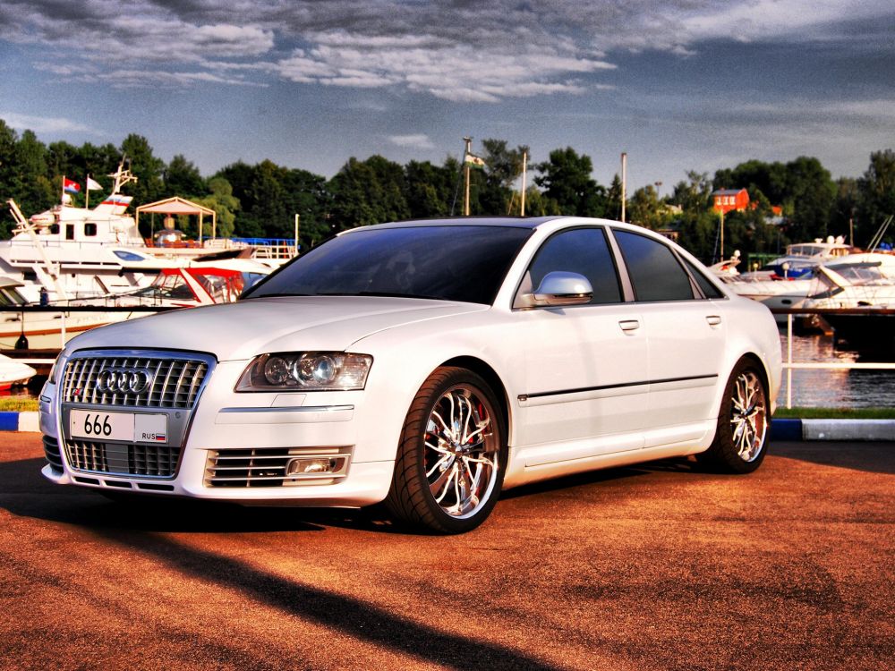 white mercedes benz coupe on brown soil