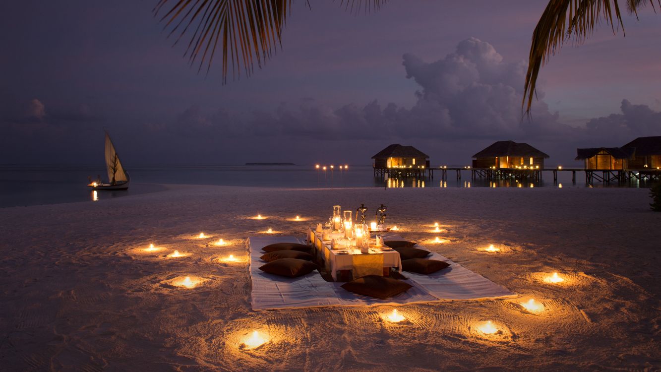 brown wooden gazebo on beach during night time