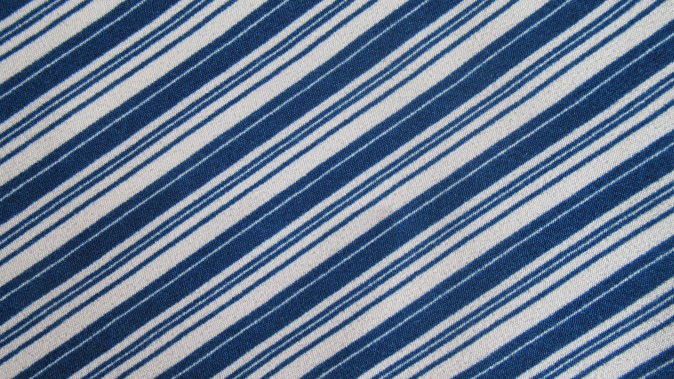 blue and white striped textile