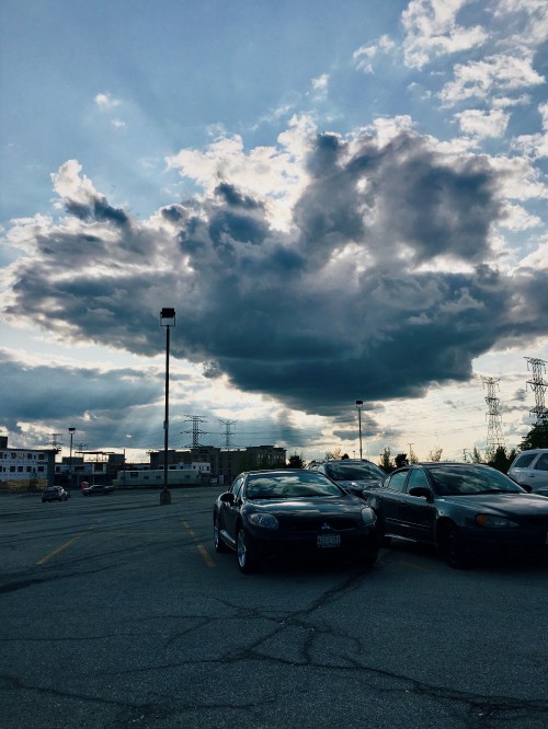 Image cars on road under cloudy sky during daytime