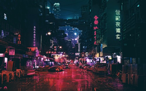 Image people sitting on chairs near street during night time