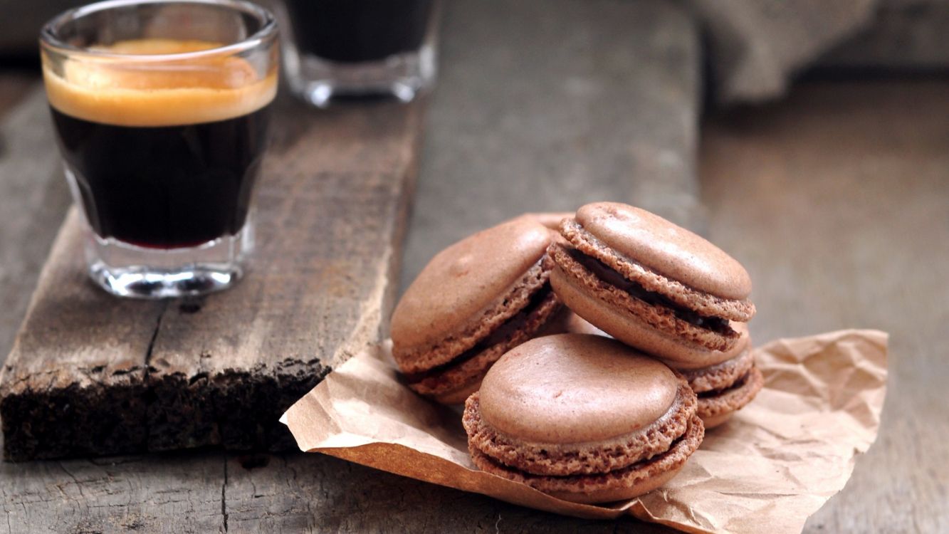 two brown breads on brown wooden table