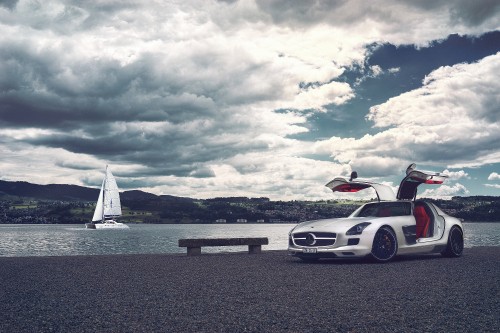 Image white porsche 911 on beach during daytime