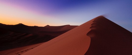 Image brown sand and mountain during daytime