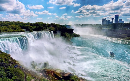 Image waterfalls under blue sky and white clouds during daytime