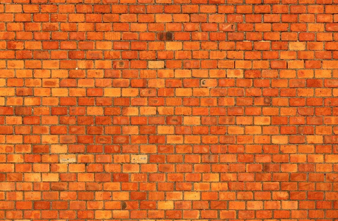 brown brick wall during daytime