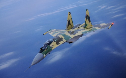 Image green and black fighter jet flying in the sky during daytime