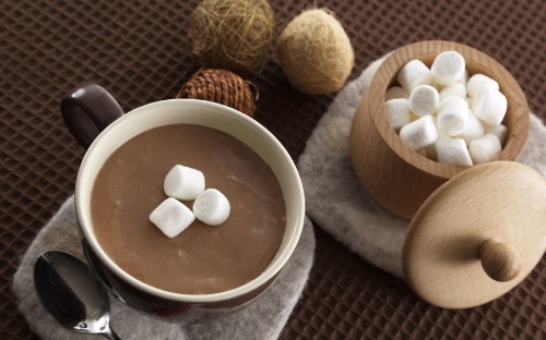 Image white ceramic bowl with brown liquid inside