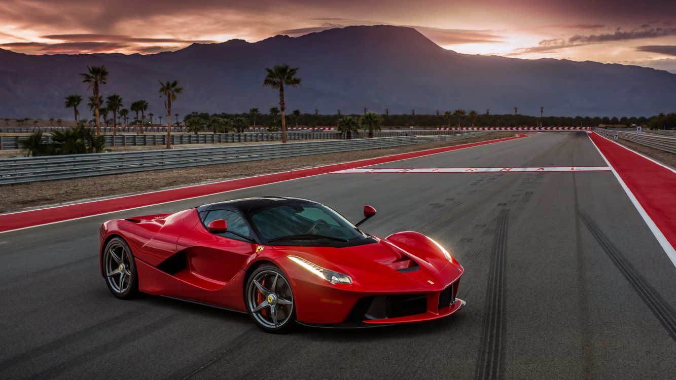 red ferrari 458 italia on road during daytime