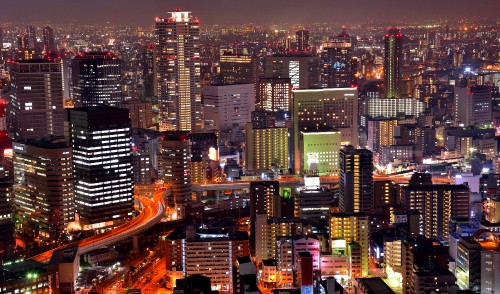 Image city with high rise buildings during night time