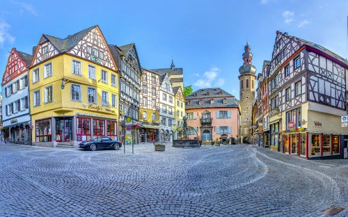 Image cars parked beside road near buildings during daytime