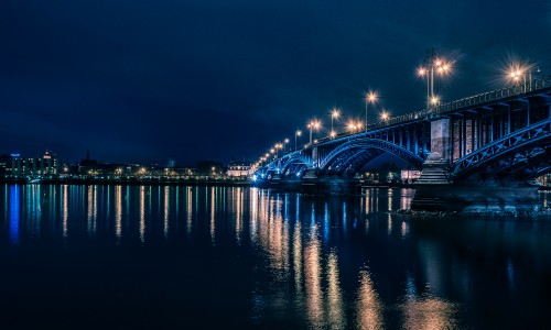 Image bridge over water during night time