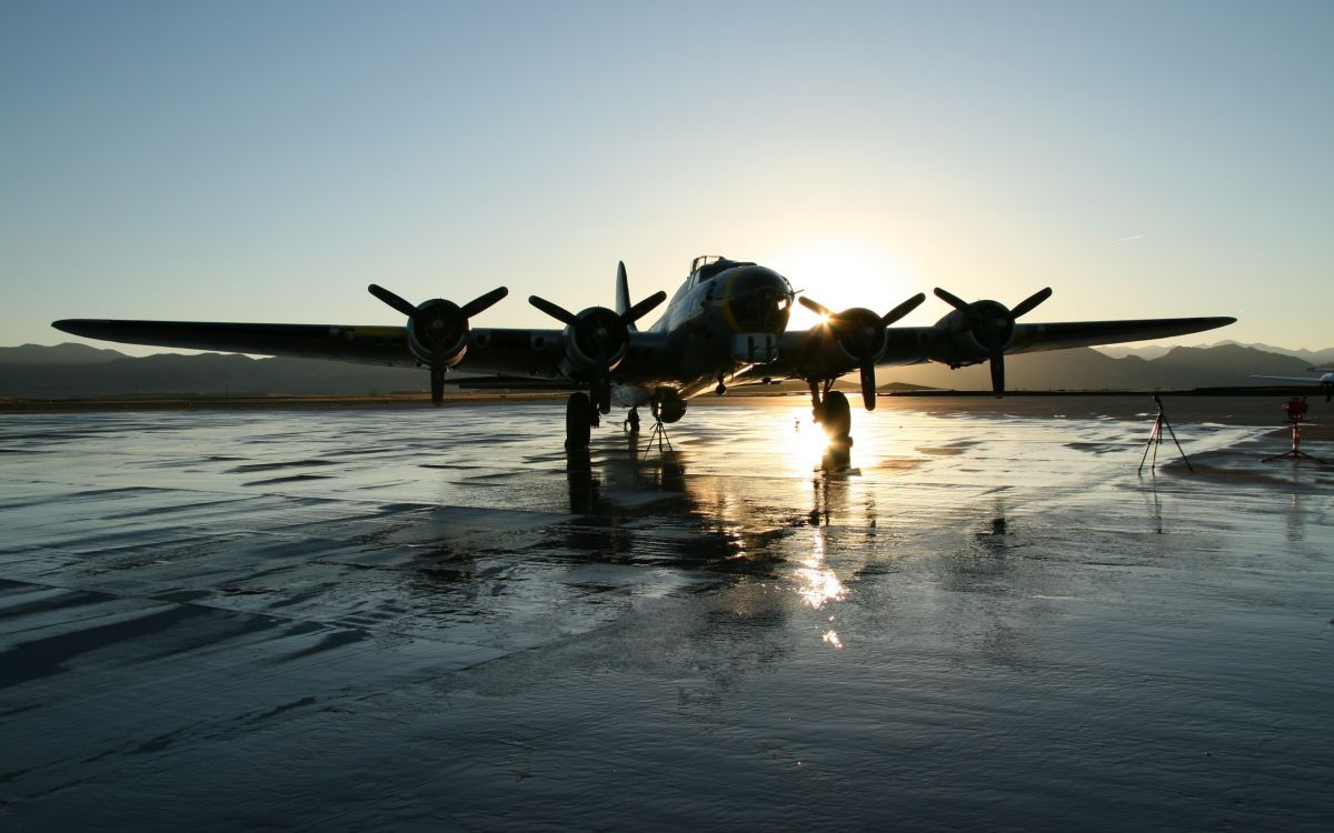 black fighter plane on the sea during daytime