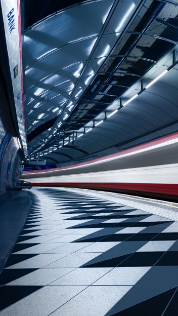 Image red and white train in a tunnel