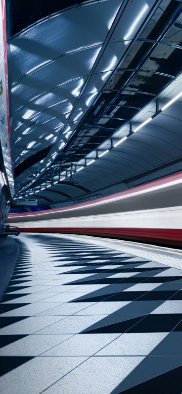 Image red and white train in a tunnel