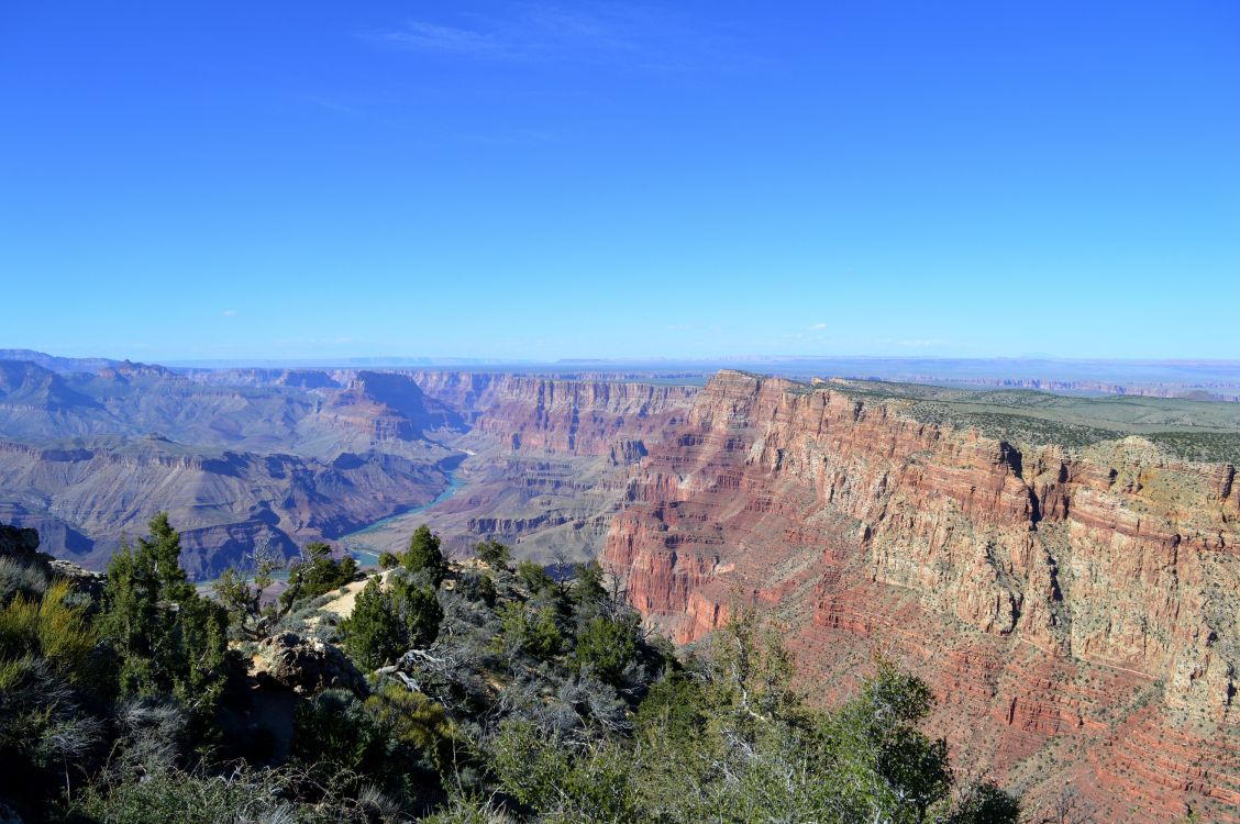 brown rocky mountain under blue sky during daytime