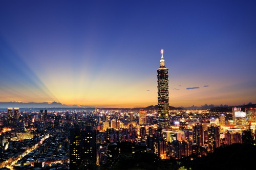 Image city with high rise buildings during night time