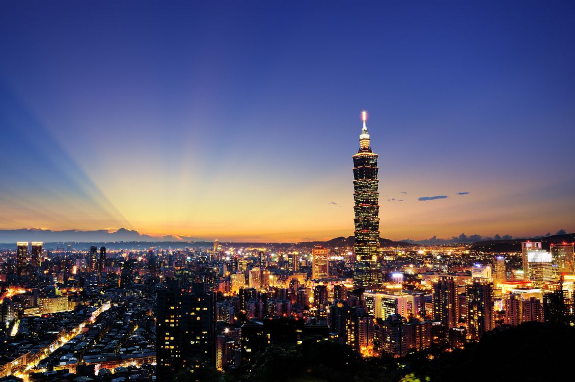 city with high rise buildings during night time