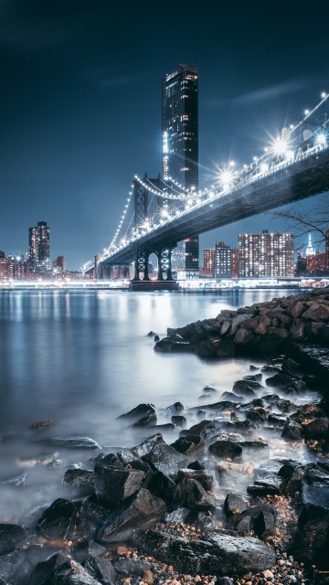 Image bridge over water during night time