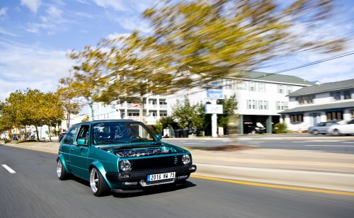 Image blue volkswagen golf on road during daytime