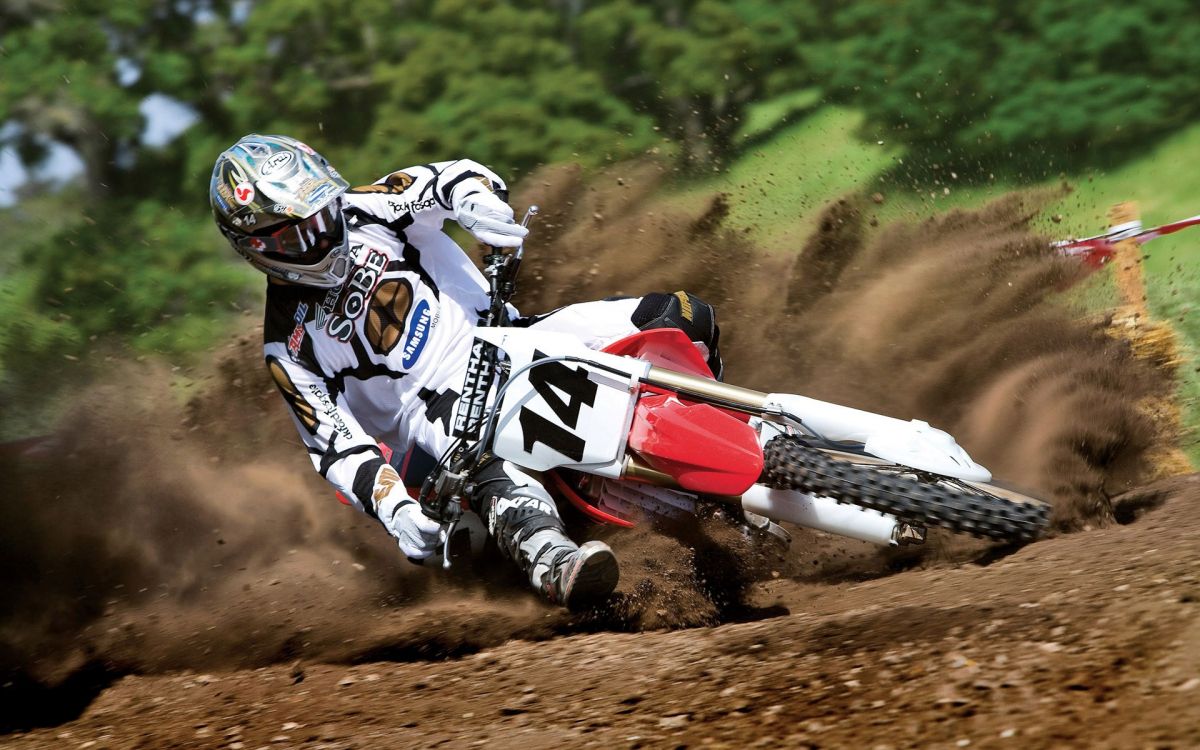 Man Riding Red and White Motocross Dirt Bike. Wallpaper in 1920x1200 Resolution