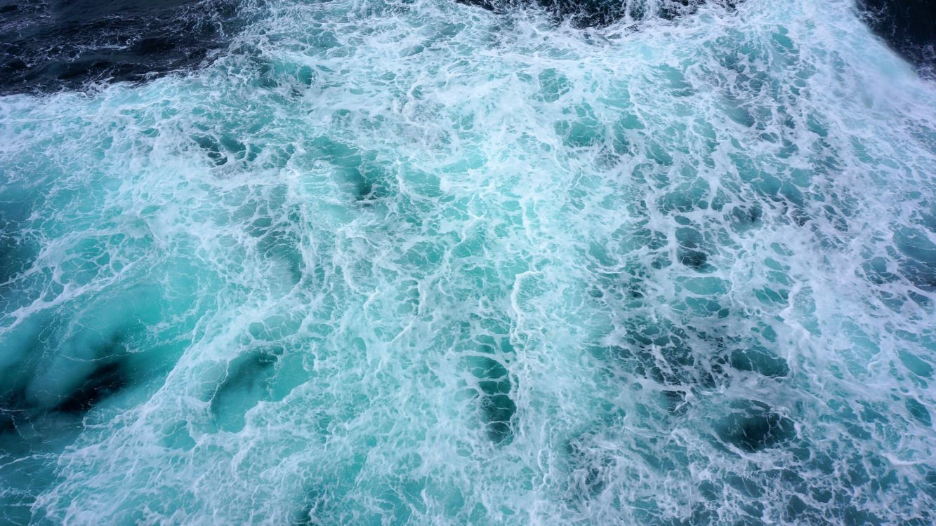 water waves on black and white surface