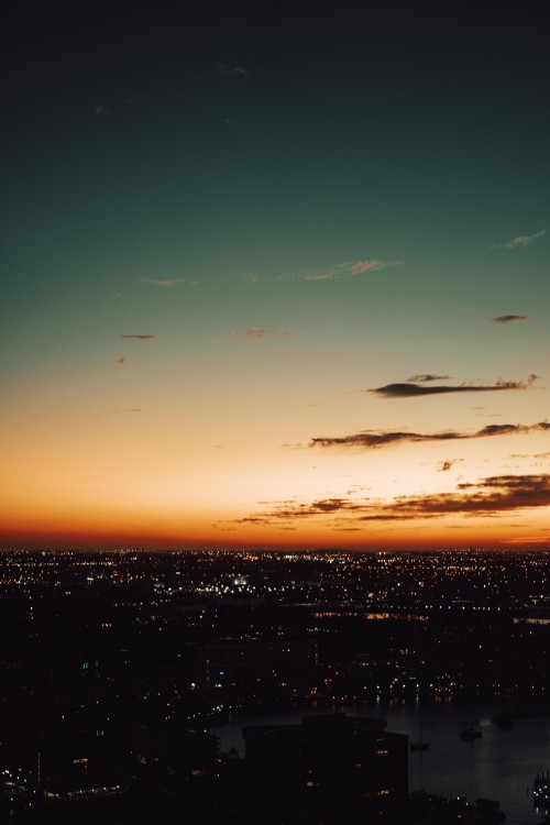 Image silhouette of city buildings during sunset