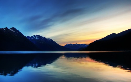 Image body of water near mountain during daytime