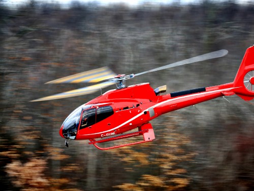 Image red and white helicopter on the sky