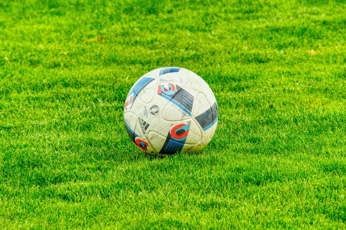 White Soccer Ball on Green Grass Field During Daytime. Wallpaper in 6000x4000 Resolution