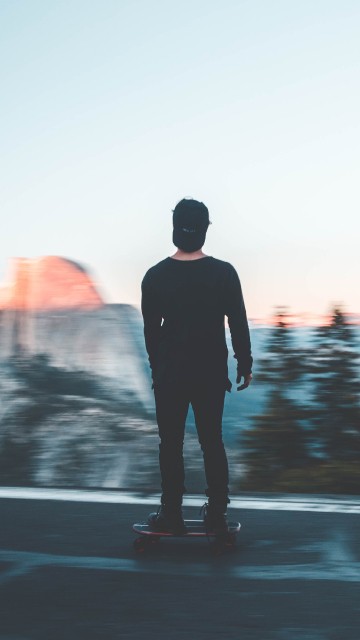 Image man in black jacket standing on road during daytime