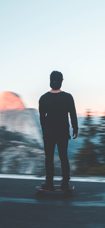 Image man in black jacket standing on road during daytime